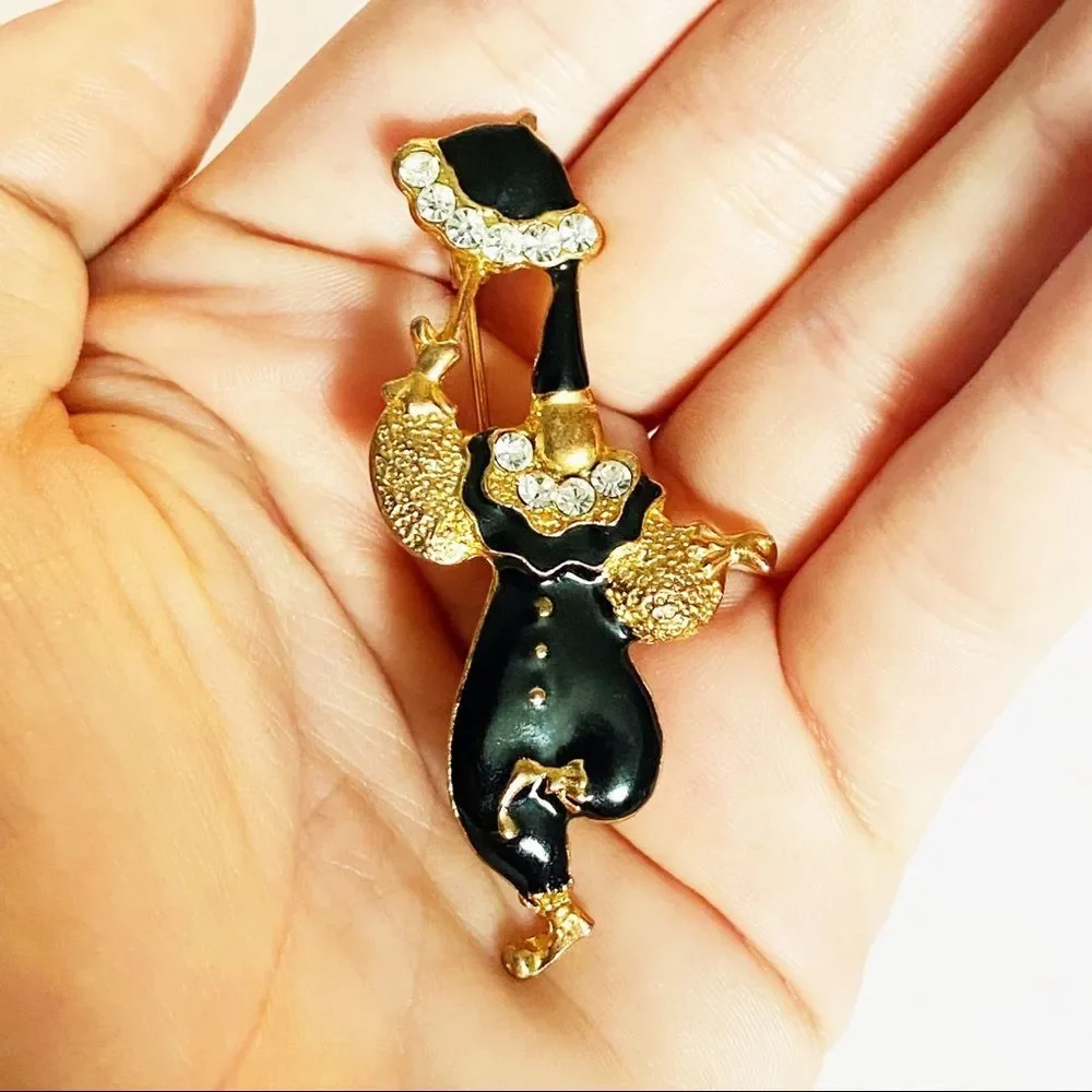 Vintage gold enamel rhinestone clown brooch
